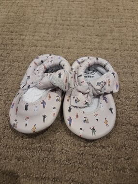 Freshly Picked Light Pink Baby Moccasins with People Print